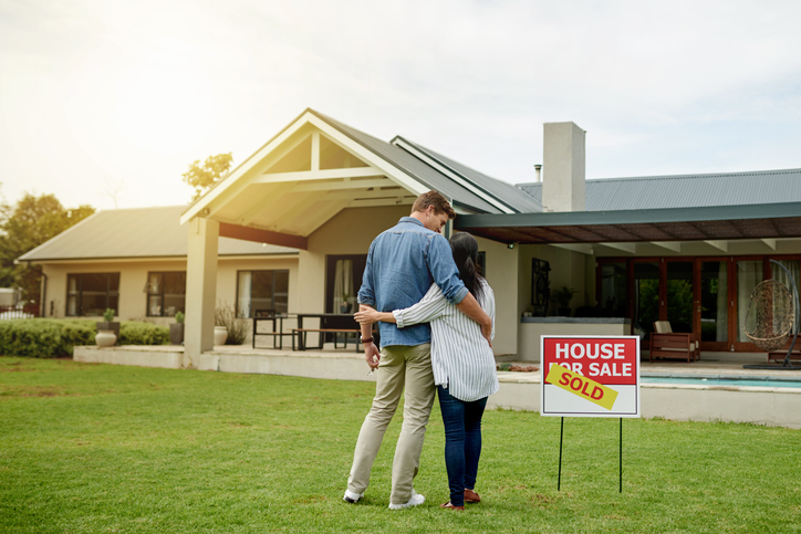 Couple looking forward to moving in the home they just bought